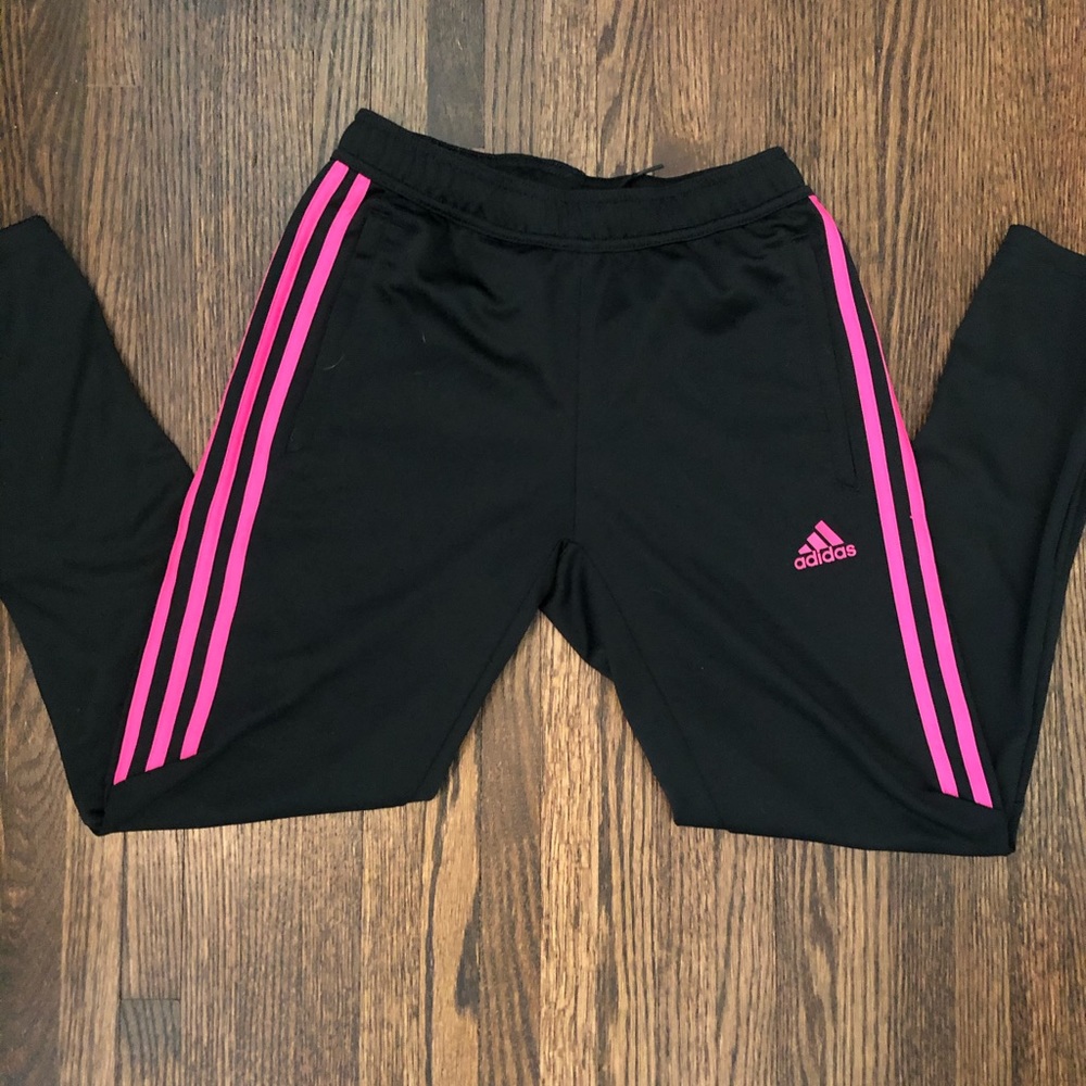 Adidas track pants with pink stripes